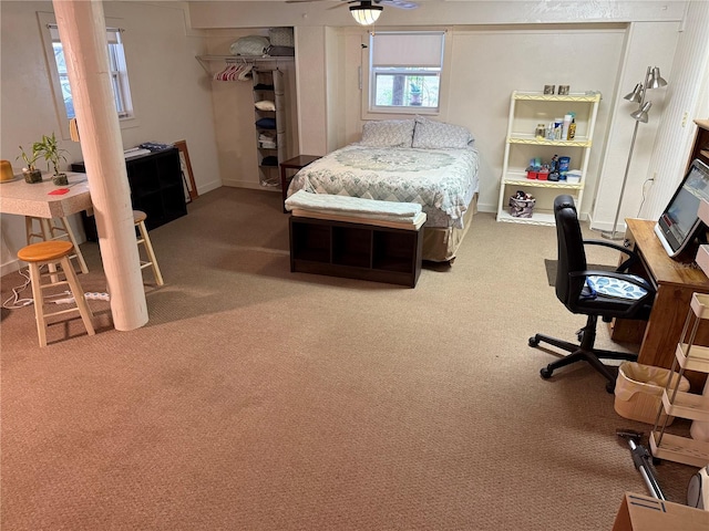 bedroom with a closet, carpet floors, and ceiling fan