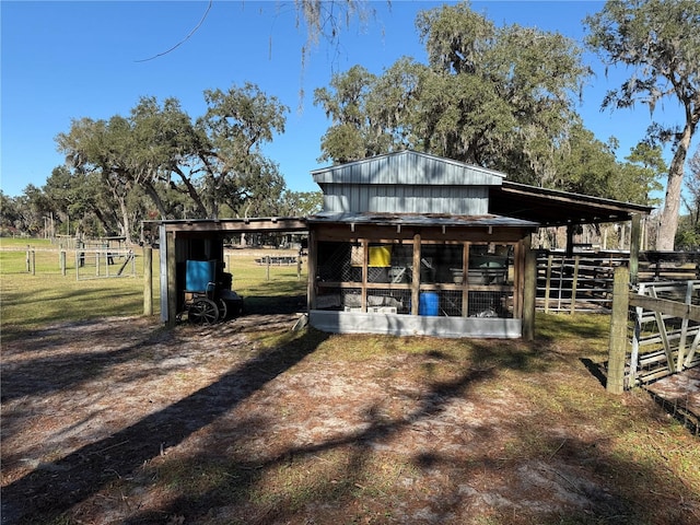 view of outbuilding with a rural view