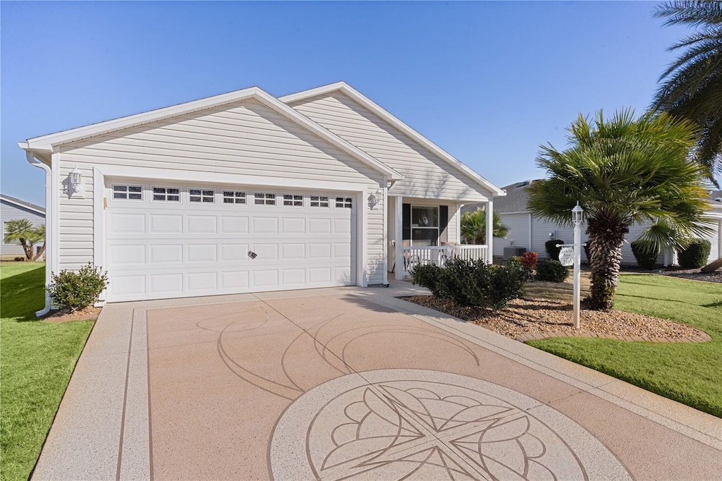 ranch-style house with a porch, a garage, and a front lawn