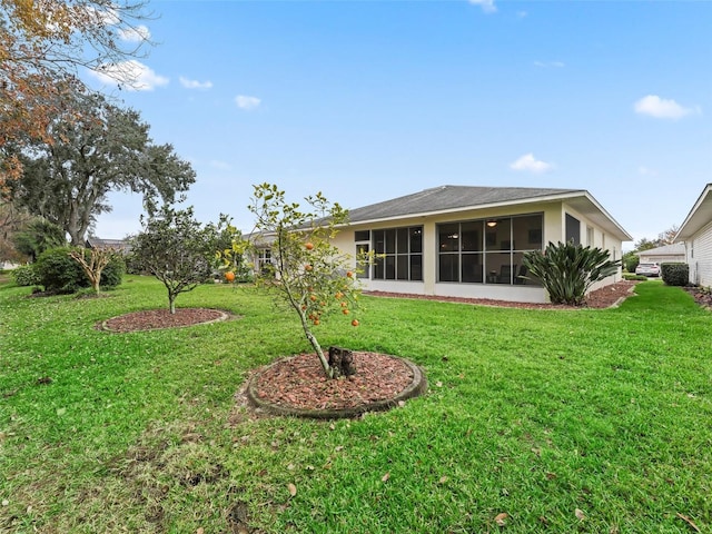 view of yard featuring a sunroom