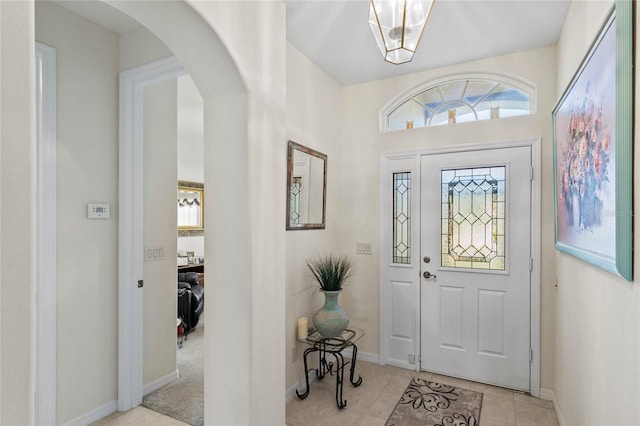 foyer entrance with light tile patterned flooring