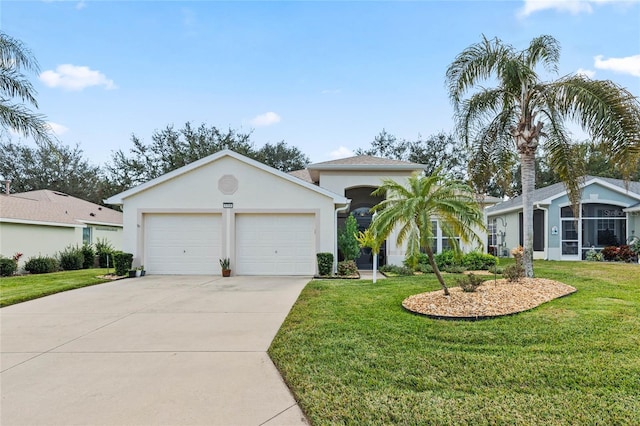 view of front of house with a front yard and a garage