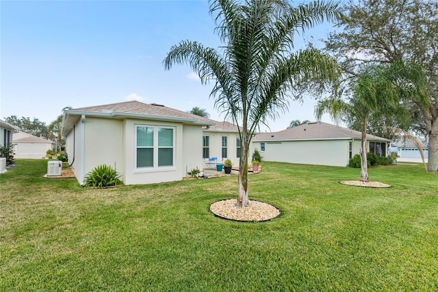 back of property featuring a lawn