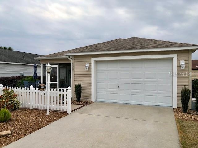 single story home with a garage