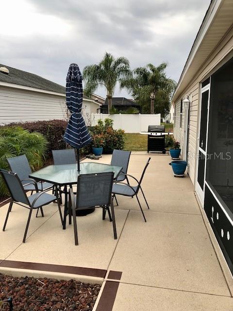 view of patio featuring a grill