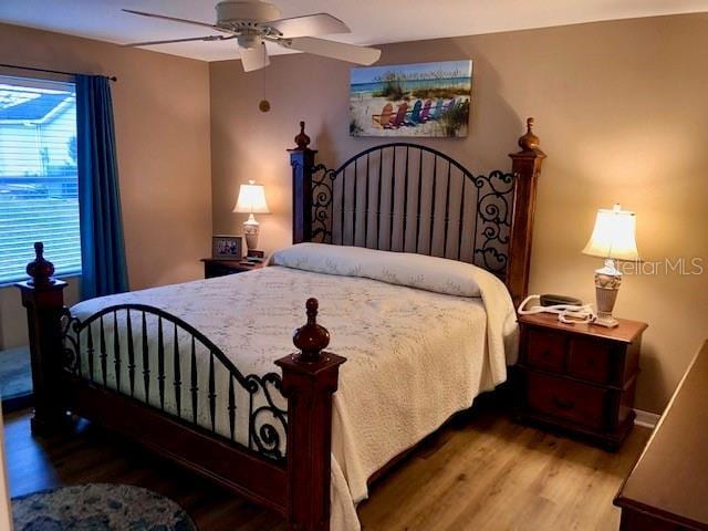 bedroom featuring ceiling fan and hardwood / wood-style floors