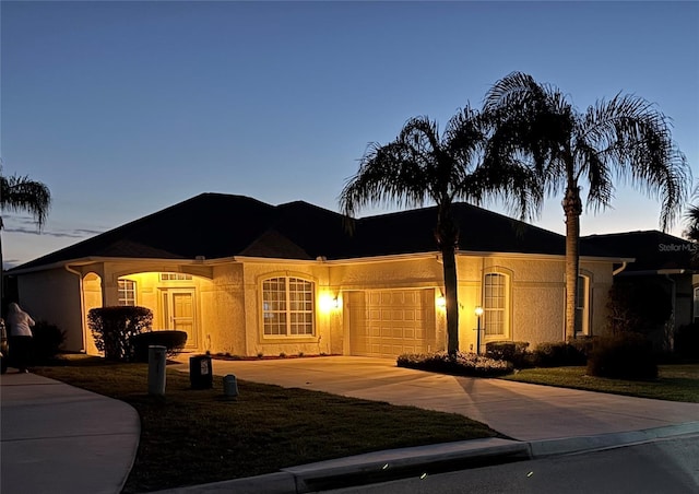 ranch-style house featuring a garage