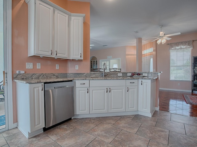 kitchen with white cabinetry, stainless steel dishwasher, and ceiling fan