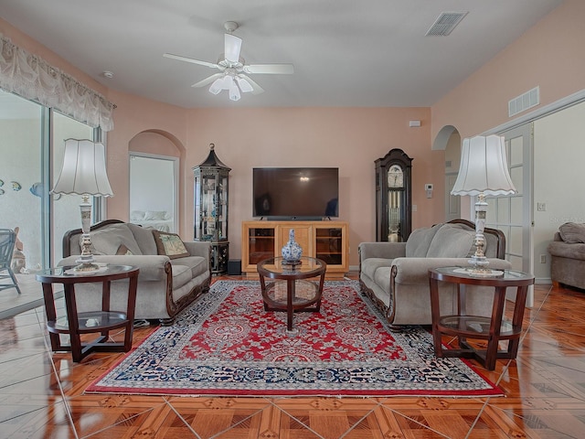 living room featuring ceiling fan