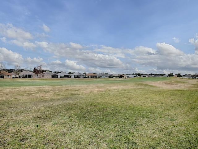 surrounding community featuring a lawn