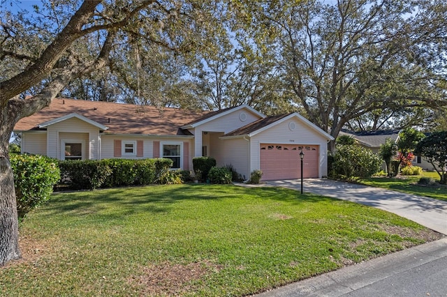 ranch-style house with a front yard and a garage