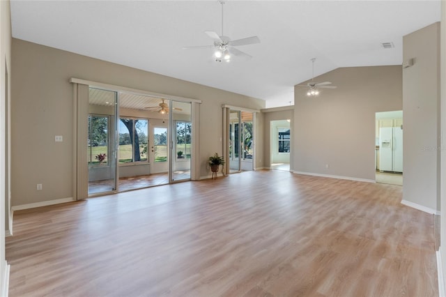 unfurnished living room with ceiling fan, light wood-type flooring, and vaulted ceiling