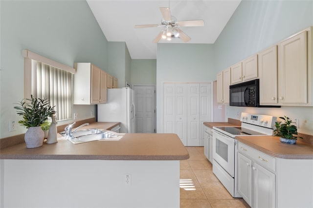 kitchen featuring white appliances, a towering ceiling, light tile patterned floors, ceiling fan, and sink