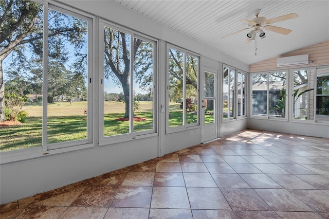 unfurnished sunroom featuring a wall unit AC, ceiling fan, and vaulted ceiling