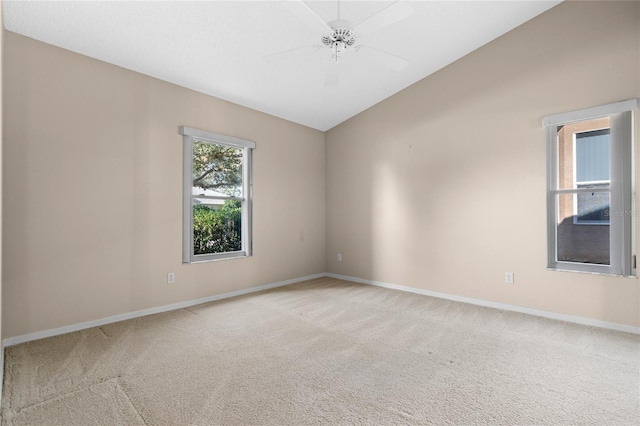 carpeted spare room with ceiling fan