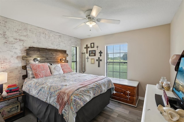 bedroom featuring ceiling fan and hardwood / wood-style flooring