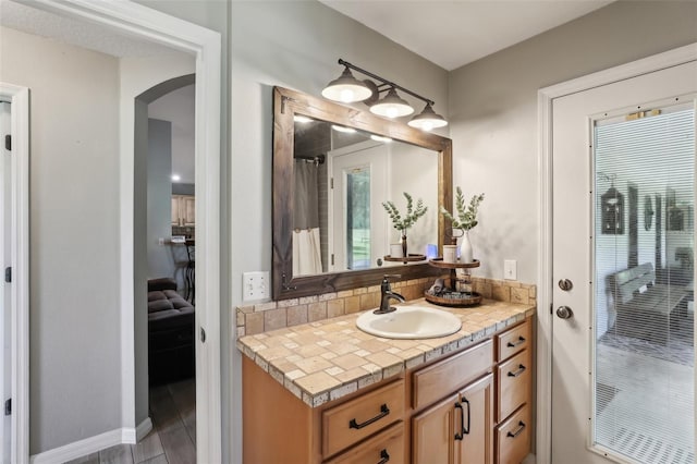 bathroom featuring vanity and wood-type flooring