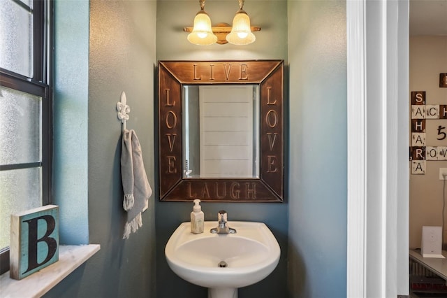 bathroom with sink and a healthy amount of sunlight