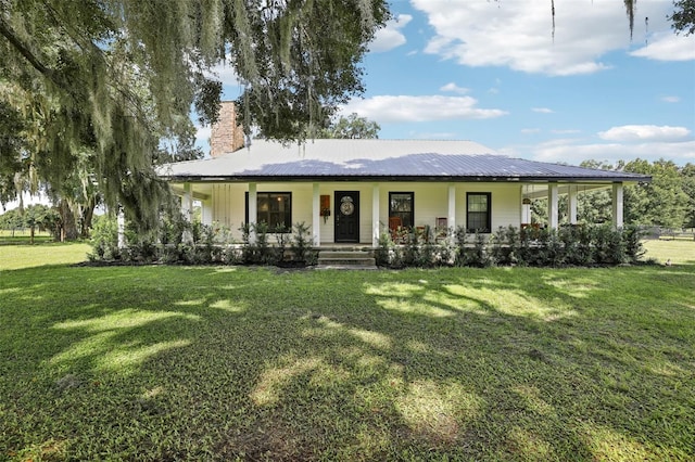 view of front of property with a front yard and covered porch