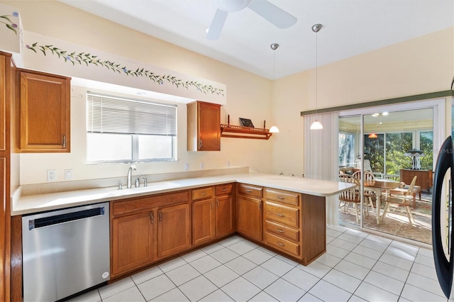 kitchen featuring sink, light tile patterned floors, kitchen peninsula, stainless steel dishwasher, and pendant lighting