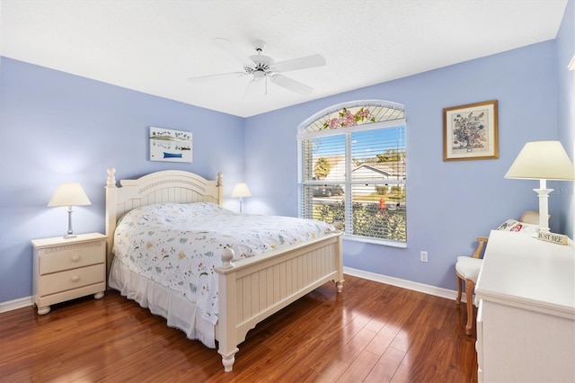 bedroom featuring ceiling fan and dark hardwood / wood-style floors