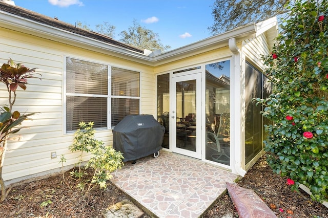 property entrance featuring a patio area