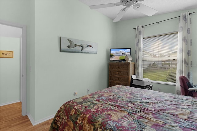 bedroom featuring light hardwood / wood-style flooring and ceiling fan