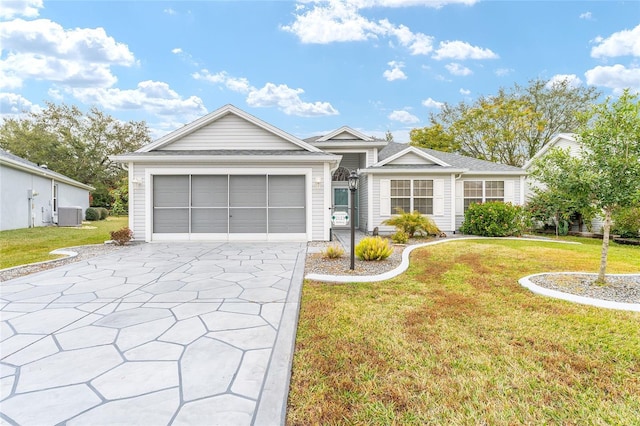 single story home featuring a front yard, central AC, and a garage