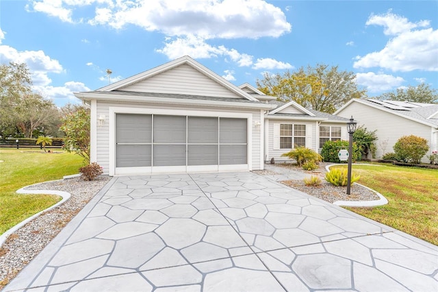 view of front facade with a garage and a front yard