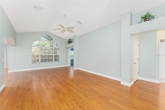 unfurnished living room with ceiling fan, vaulted ceiling, and light hardwood / wood-style floors