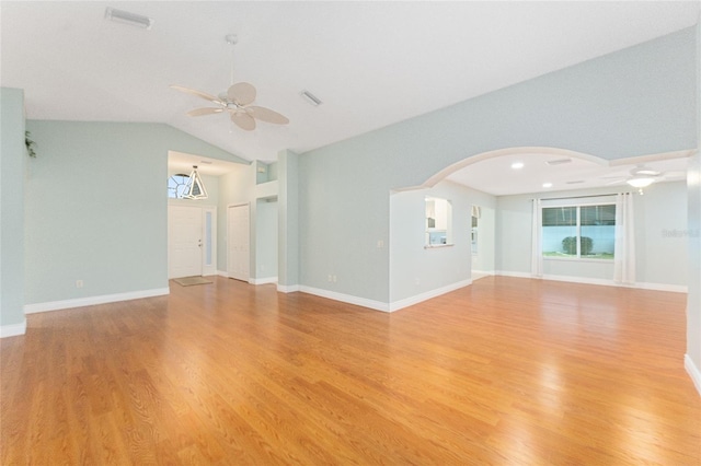 unfurnished living room featuring ceiling fan, light hardwood / wood-style floors, and lofted ceiling