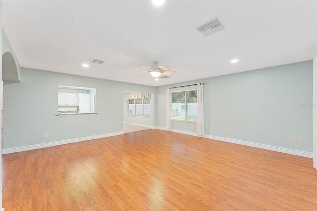 spare room featuring ceiling fan and light hardwood / wood-style floors