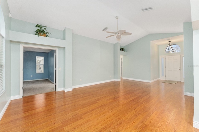 unfurnished living room featuring light wood-type flooring, ceiling fan, and lofted ceiling