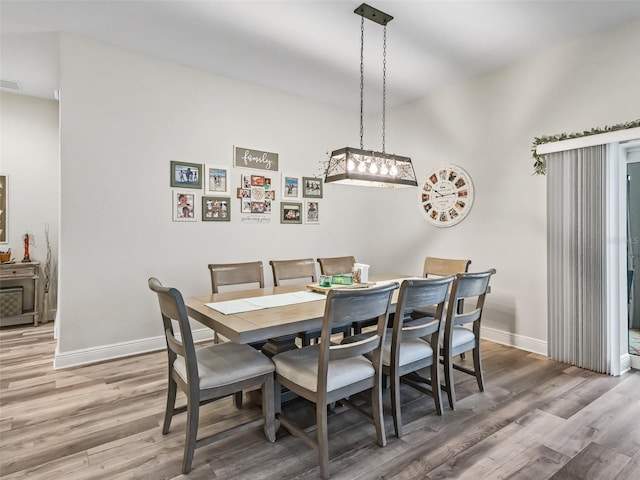 dining space featuring hardwood / wood-style floors