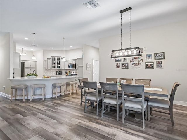 dining area featuring dark hardwood / wood-style flooring