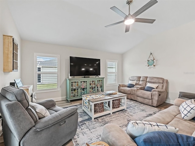 living room with lofted ceiling, wood-type flooring, and ceiling fan