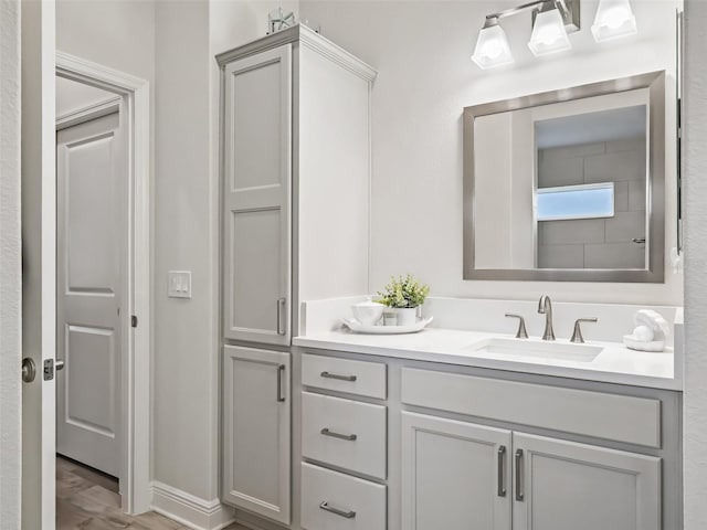 bathroom featuring vanity and hardwood / wood-style floors