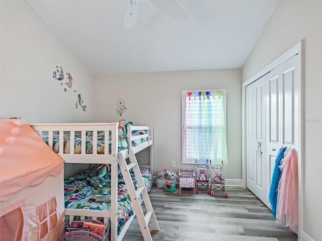 bedroom with ceiling fan, a closet, and hardwood / wood-style floors