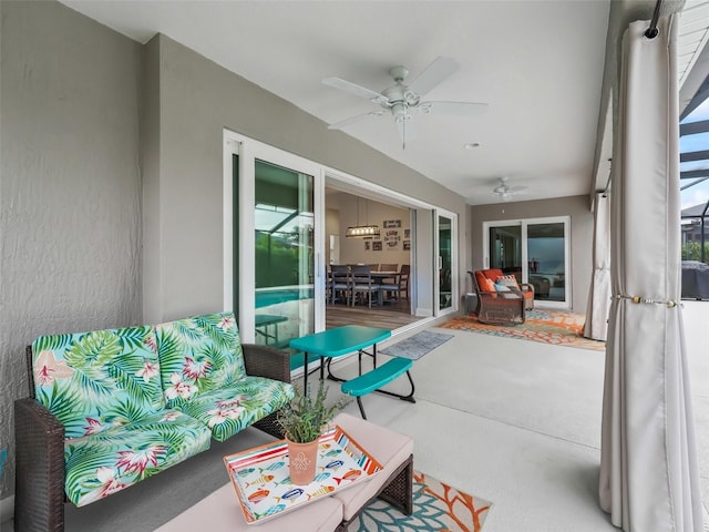 sunroom featuring ceiling fan and a healthy amount of sunlight