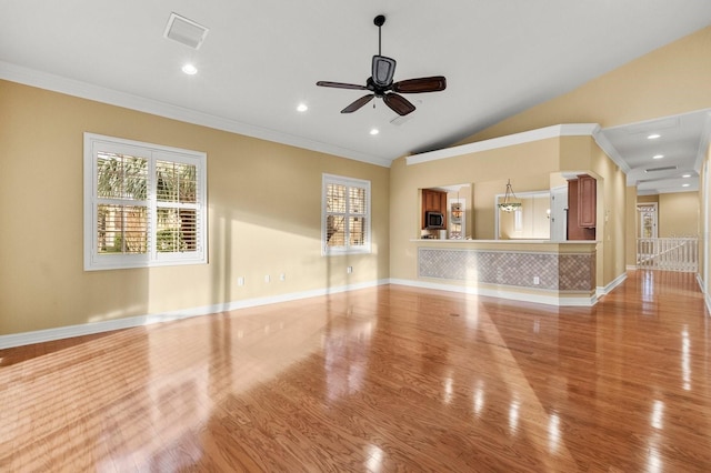 unfurnished living room with crown molding, ceiling fan, lofted ceiling, and light hardwood / wood-style floors