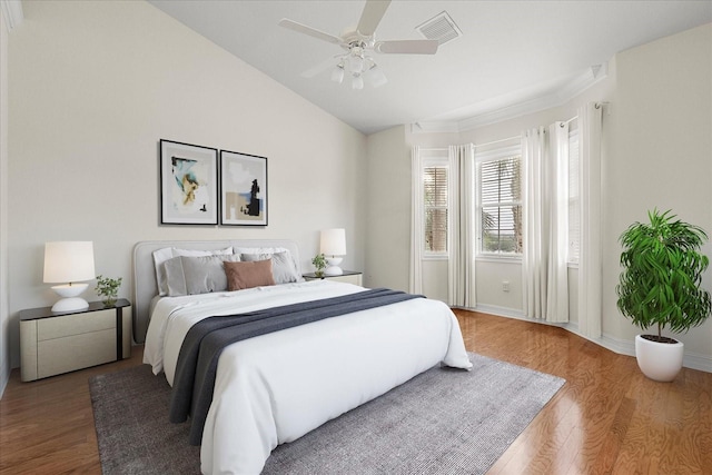 bedroom with lofted ceiling, wood-type flooring, and ceiling fan