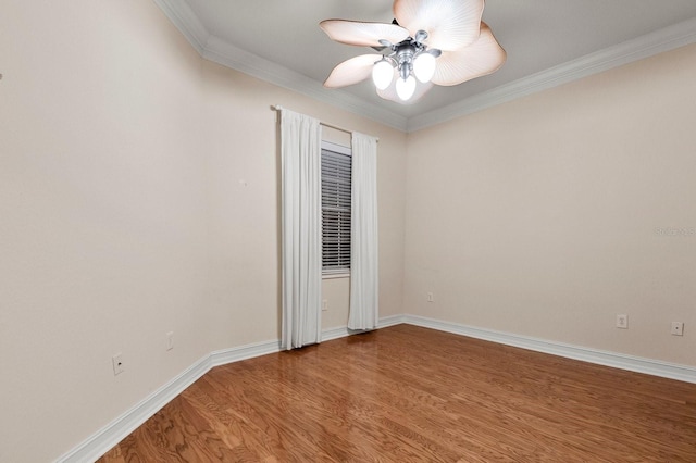 spare room with wood-type flooring, ornamental molding, and ceiling fan