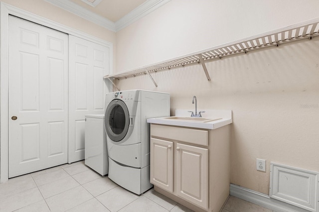 washroom featuring cabinets, ornamental molding, sink, and light tile patterned floors