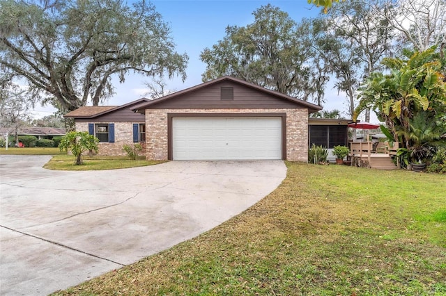 single story home with a garage and a front lawn