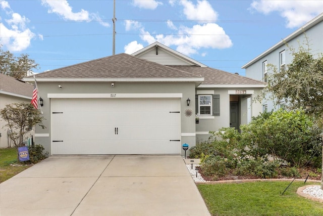 view of front of home with a front yard and a garage