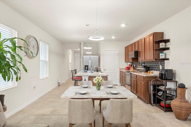 dining area featuring light tile patterned floors