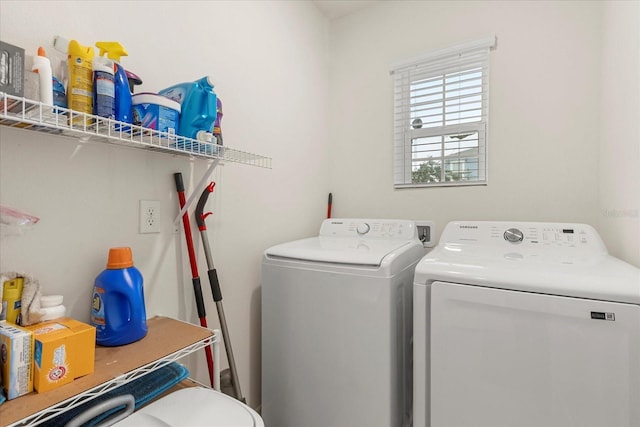 clothes washing area featuring washing machine and clothes dryer