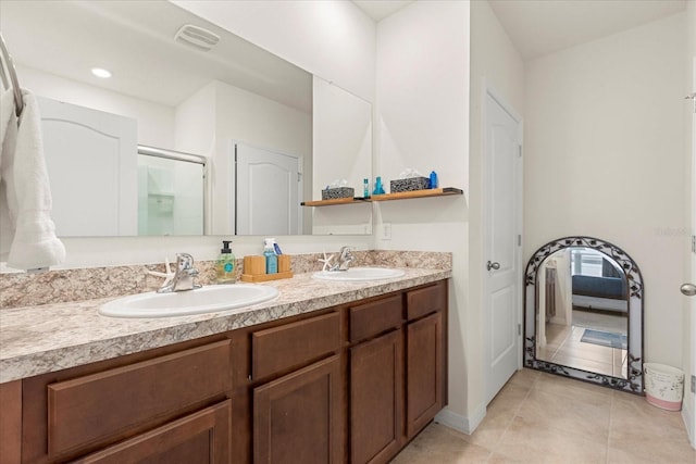 bathroom featuring tile patterned floors and vanity