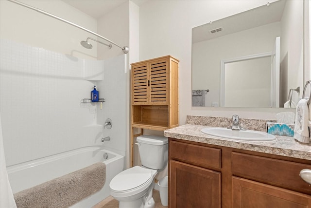 full bathroom featuring toilet, vanity, and  shower combination