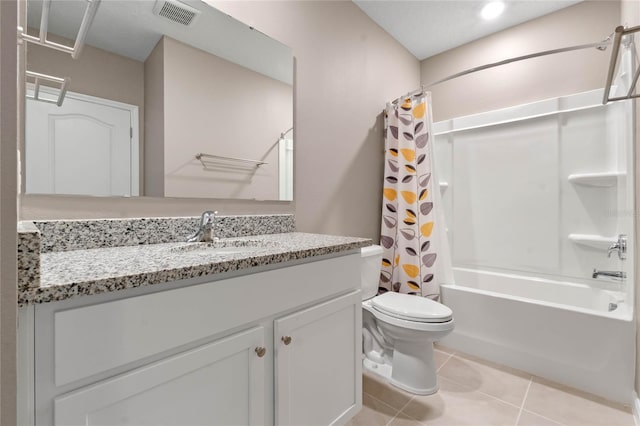 full bathroom featuring toilet, vanity, shower / bath combo, and tile patterned flooring